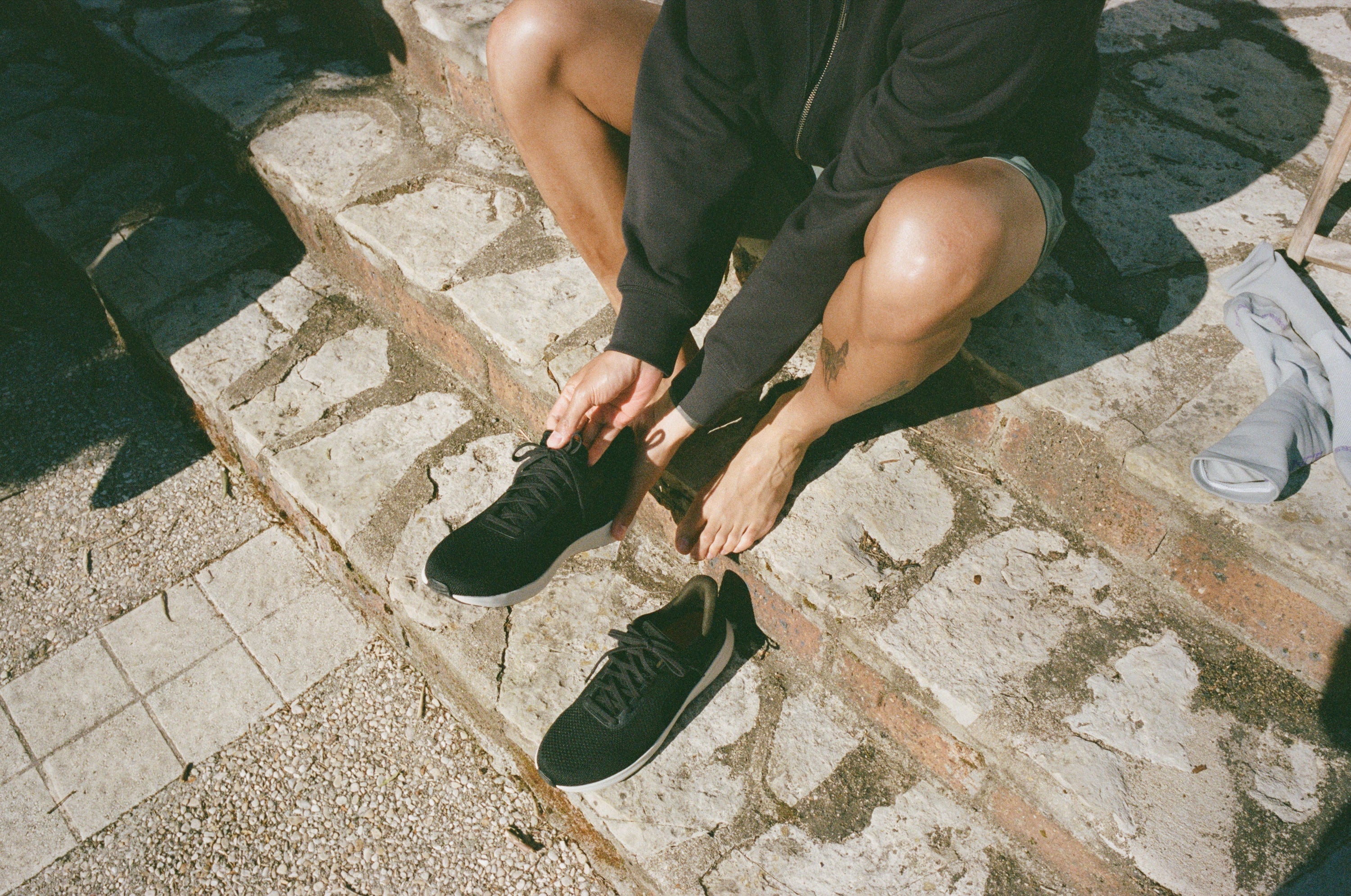 person with neuropathy of feet stepping into neuropathy shoes