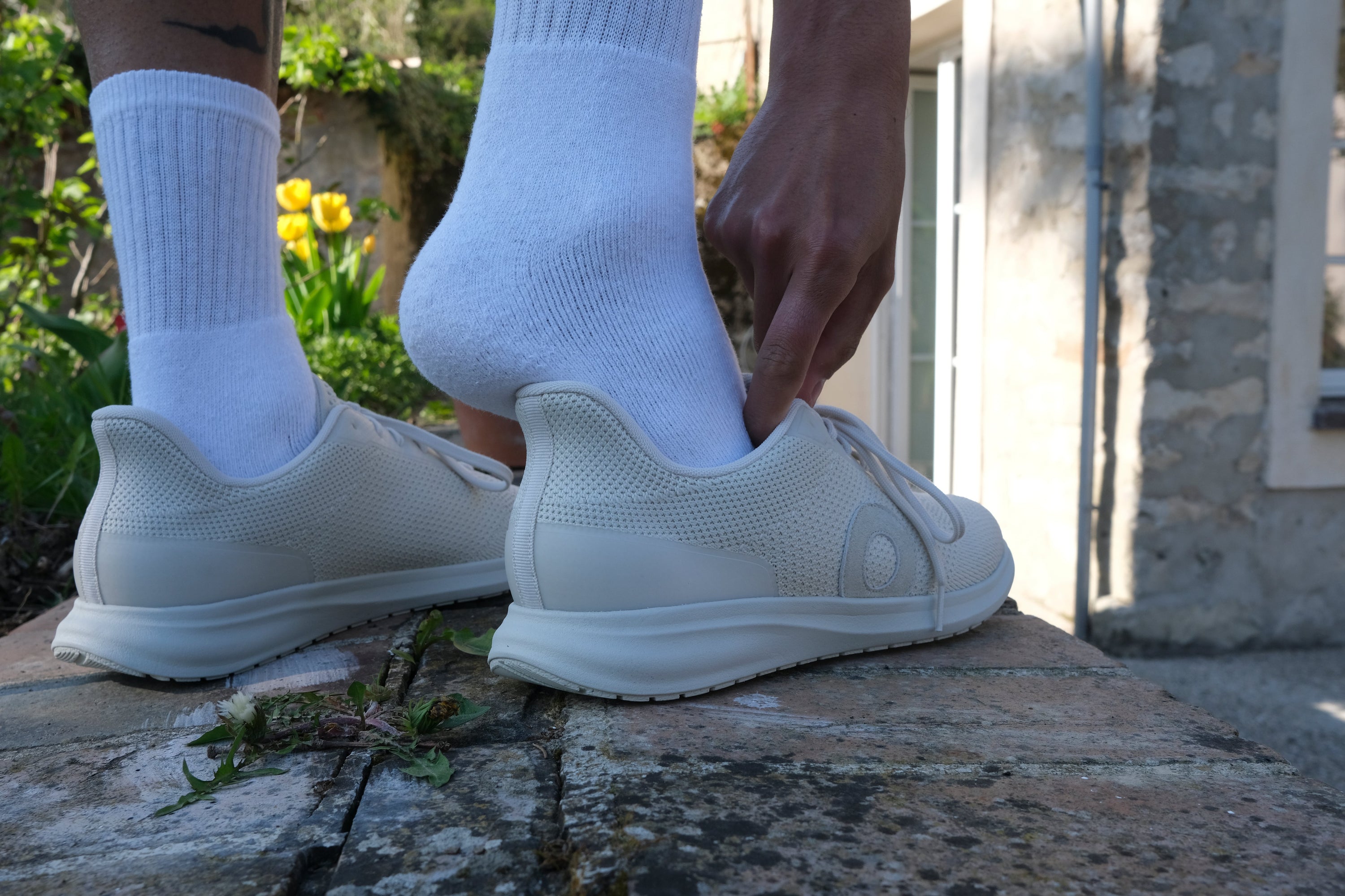 person with neuropathy in feet stepping into orthopedic shoes