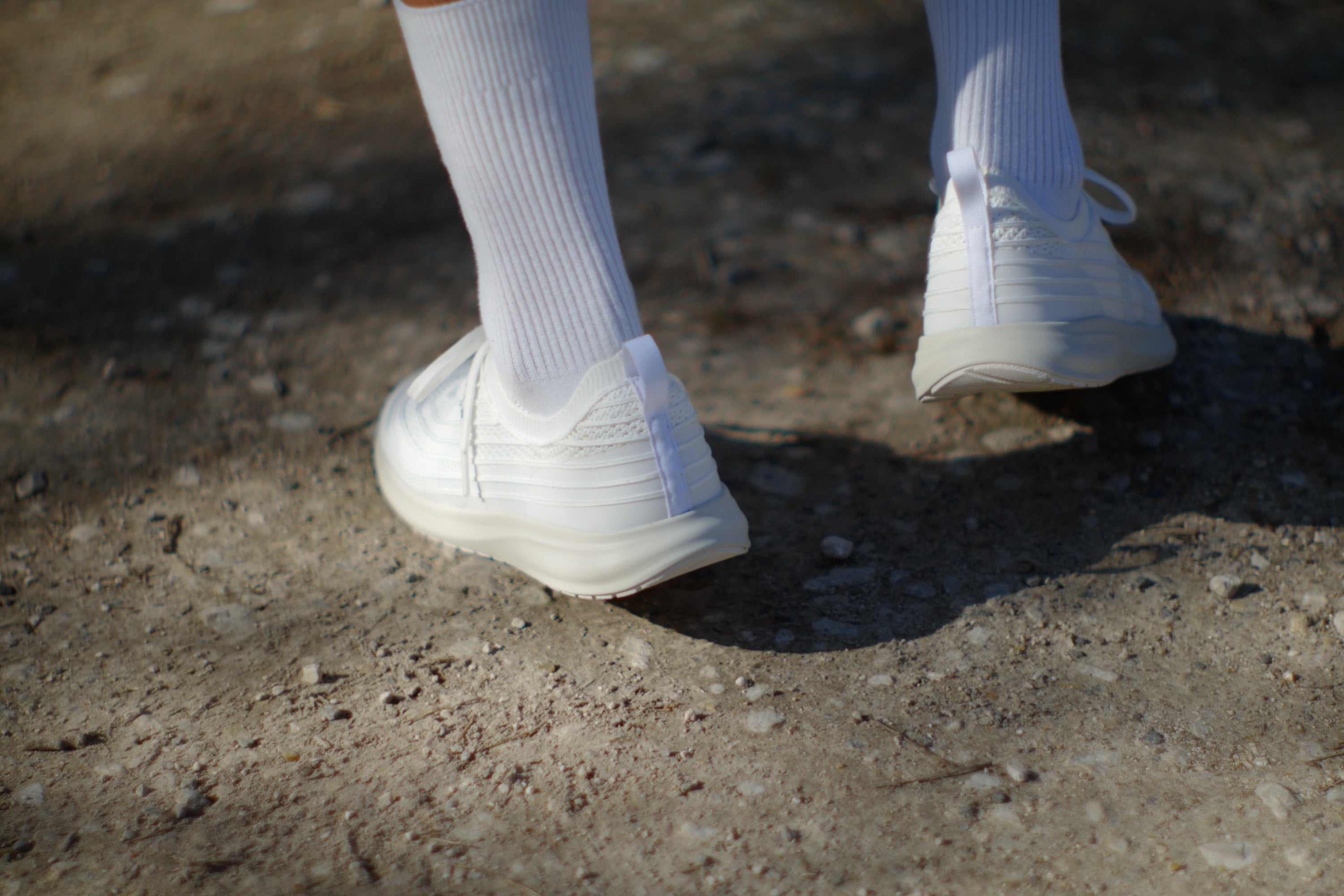 person walking to break in new shoes