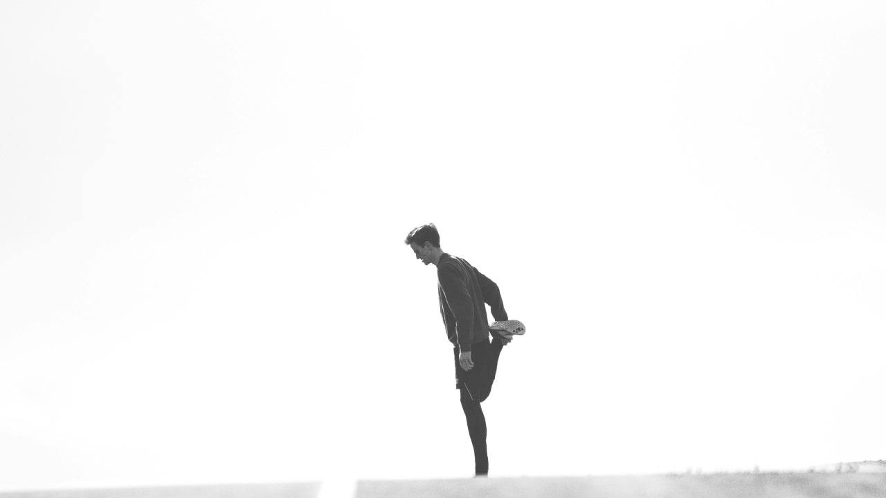 man experiencing foot pain after running