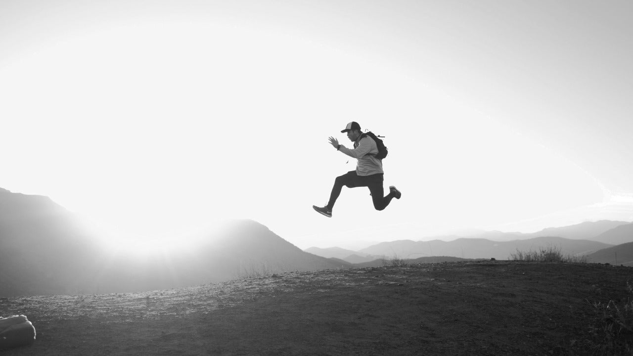man confidently jumping with strong feet