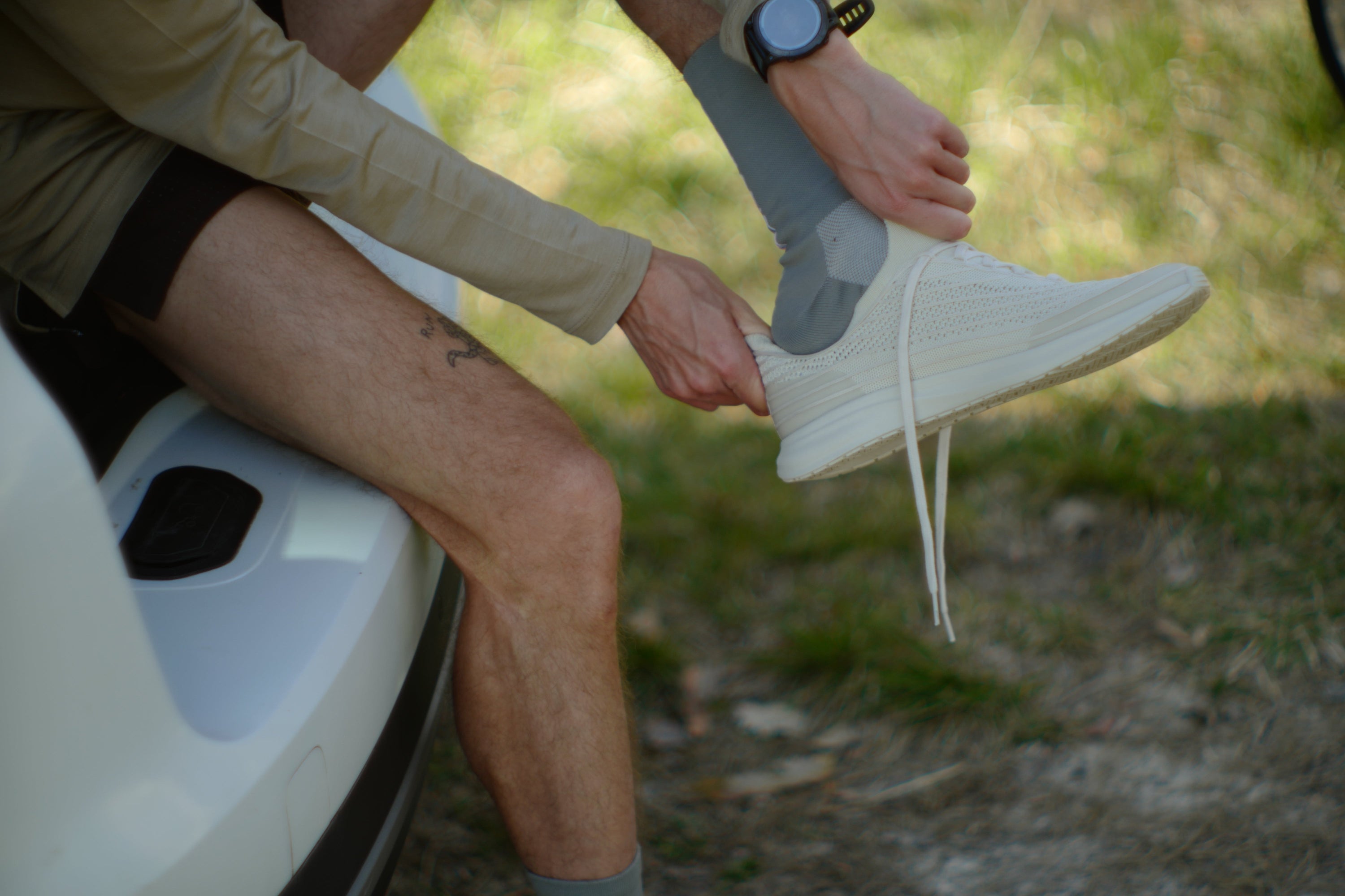 person putting on shoes to help relieve morton's neuroma symptoms